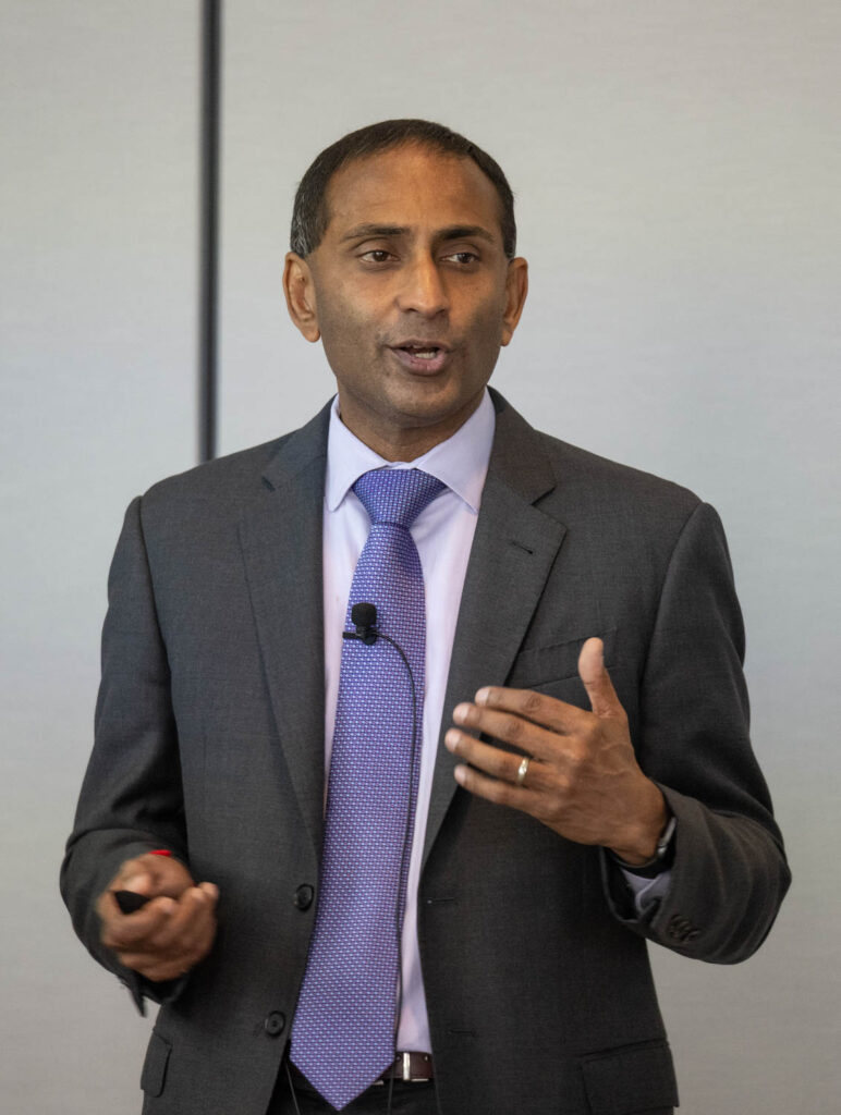 Speaker giving talk at conference