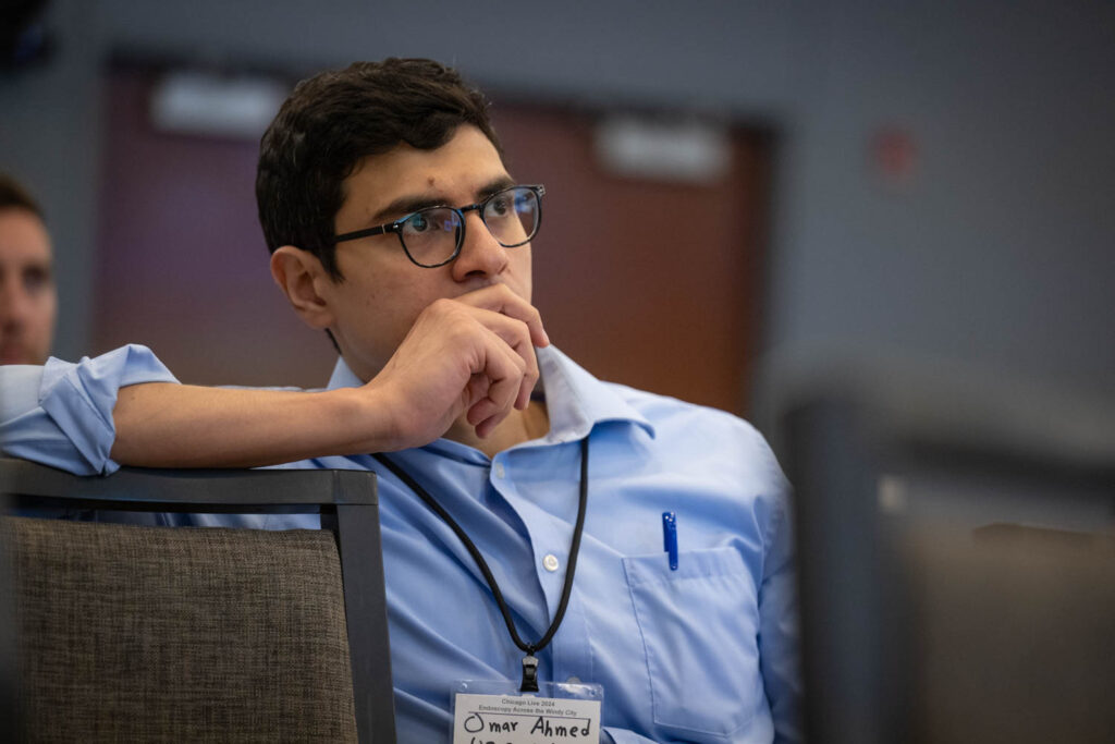 Conference attendee listening to content.